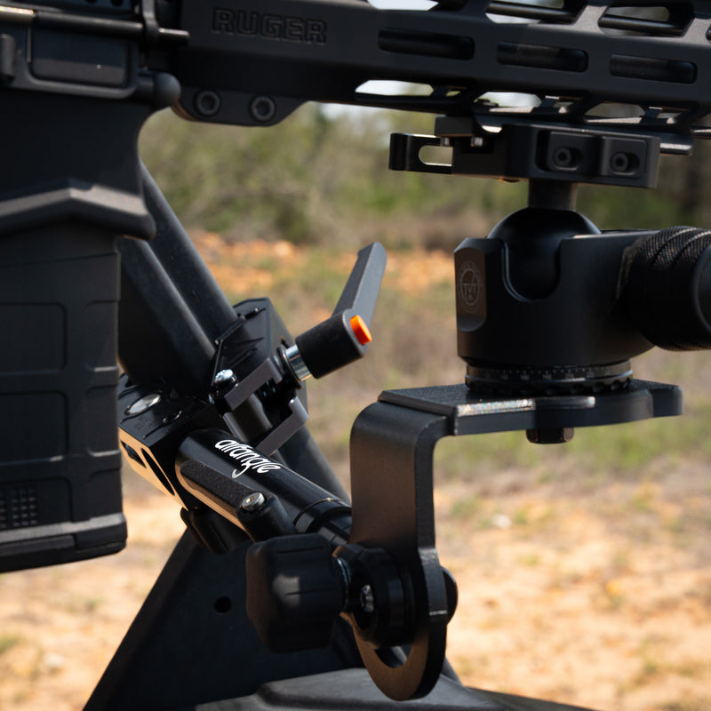 Tight crop of Hub clamped to a UTV cage with ballhead and rifle in frame